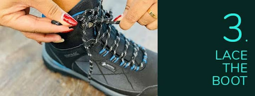 Image of walking boot with laces being tied.