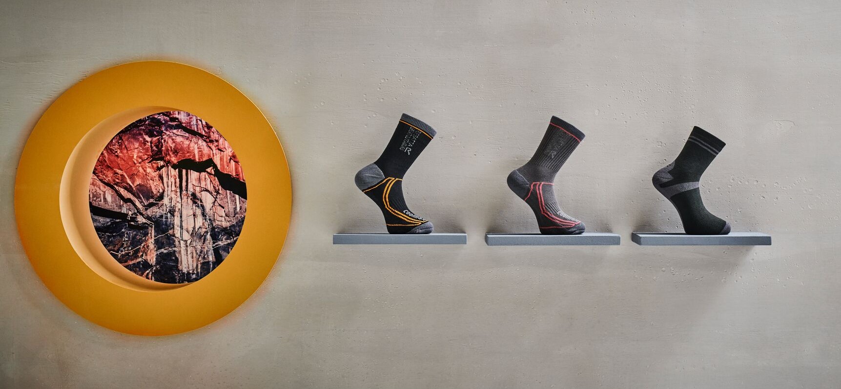 3 Black Walking socks on a display shelf